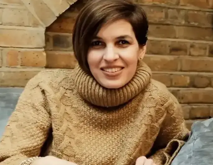 Ani Alexander smiling on couch, Women of the Future feature portrait