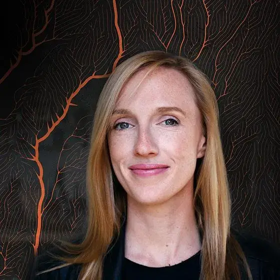 Christina Heller smiling portrait with patterned background - Woman of the Future Emerging Tech