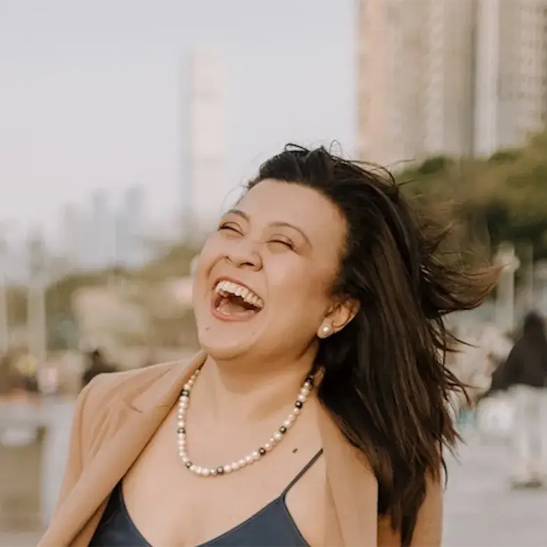 Portrait of Hanis Harmiles laughing outdoors, Woman of the Future Emerging Tech
